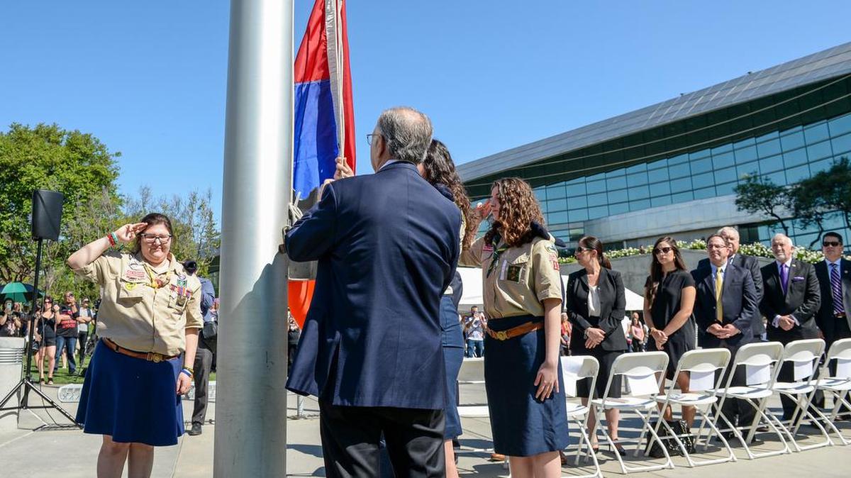 Fresno Mayor Lee Brand gets help from the Sassoon chapter of the Homenetmen Scouts as the Armenian flag is raised over Fresno City Hall during the annual flag raising ceremony held in commemoration of the victims and survivors of the Armenian Genocide on Wednesday, April 24, 2019.