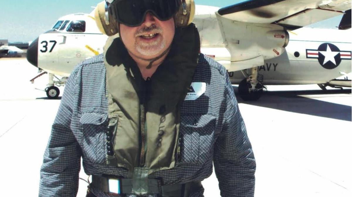 John G. Taylor and the workhorse aircraft known as C-2 Greyhound.
