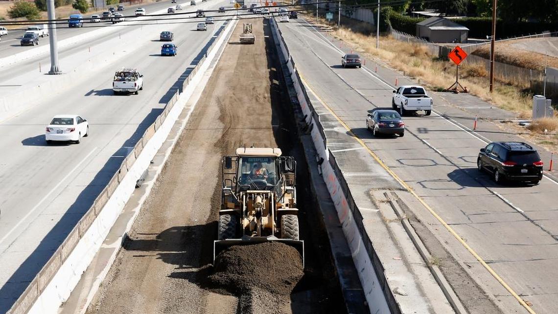 In this Oct. 15, 2015 photo, vehicles pass a highway construction site on eastbound Interstate 80 in Sacramento, Calif. Agreement on a five-year, $281 billion federal transportation bill was reached before the end of 2015, a legislative feat that lawmakers and President Barack Obama had struggled throughout his entire administration to achieve.