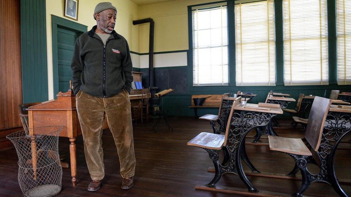 Friends of Allensworth docent Emmett Harden in the classroom of the original Allensworth schoolhouse built in 1912 at Colonel Allensworth State Historic Park near Earlimart on Thursday, Feb. 7, 2019.