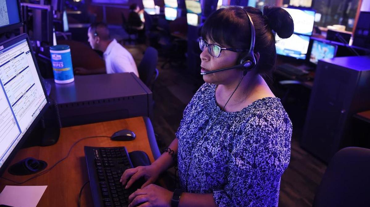 Lydia Valdez handles a call at the Fresno Police Department’s Dispatch Center. Police Chief Jerry Dyer says more dispatchers are needed for the thousands of calls police receive every day.