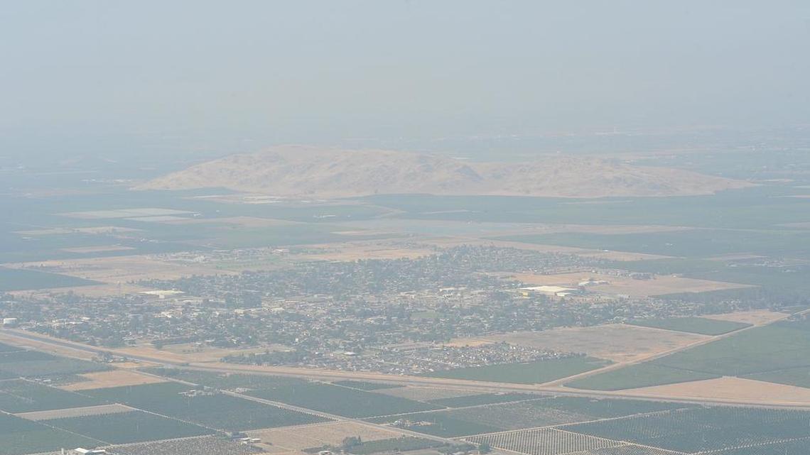 The city of Orange Cove sits in smoggy valley air in this photo taken on May 23, 2018.