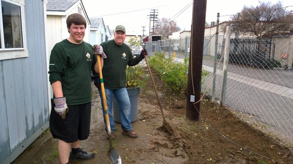 Daniel Ford, left and Earl Malan donate their time and labor to the Village of Hope at the Poverello House in downtown Fresno.
