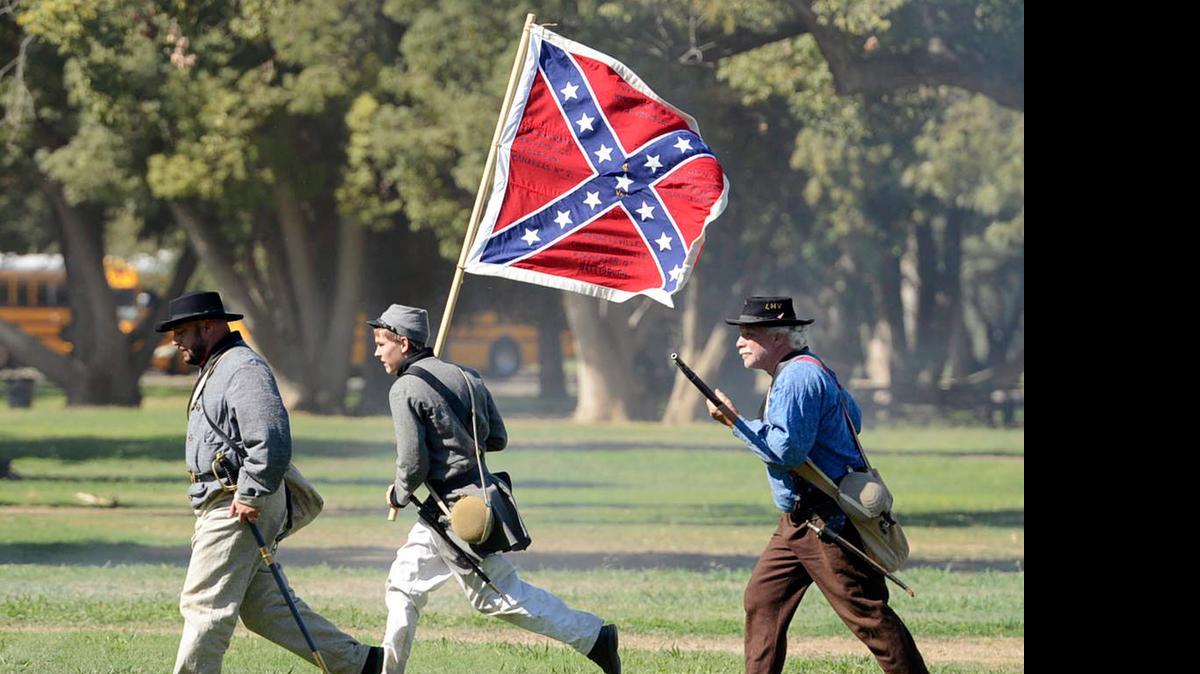 
Confederate Army re-enactors retreat to their base during the battle re-enactment at the 25th anniversary of the Civil War Revisited at Kearney Park in October. 
