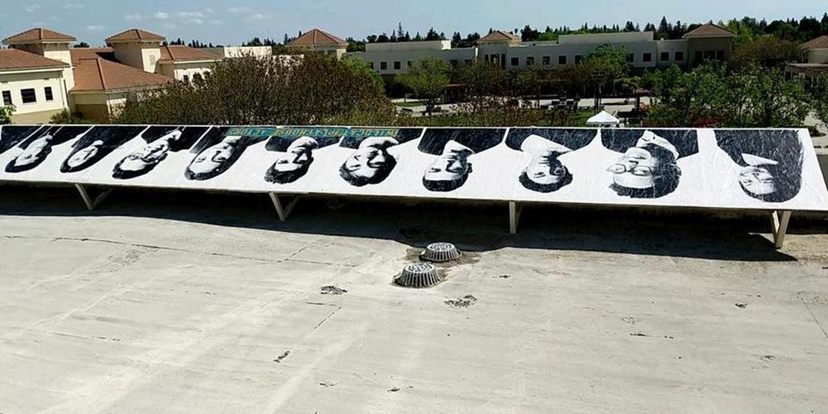 Student muralists turned their high school inside out by showing their smiles to the outside world.