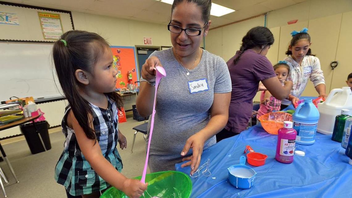 Deandra Delgado, of Five Points, learns to make sticky dough with Valley PBS lead daycare teacher Sandra Morin in a craft class as part of Valley PBS’ Early Learning Program at Westside Elementary School in Five Points in 2016.