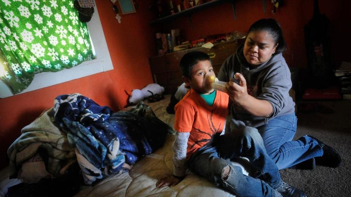 Dalia Mondragon gives an asthma treatment to her son, Renato Silva. Four of her children suffer from asthma, with Renato having it the worst. Kevin Hamilton, CEO of the Central California Asthma Collaborative, says Fresno County had nearly 7,200 emergency room visits for asthma in 2012 alone, at an average cost of over $19,000 per hospitalization.