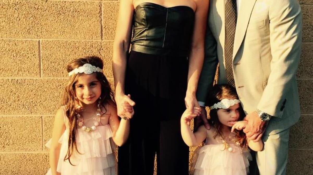 Jill Simonian with her two daughters, flower girls in a recent family wedding, and her husband, Dr. Andre Panossian.