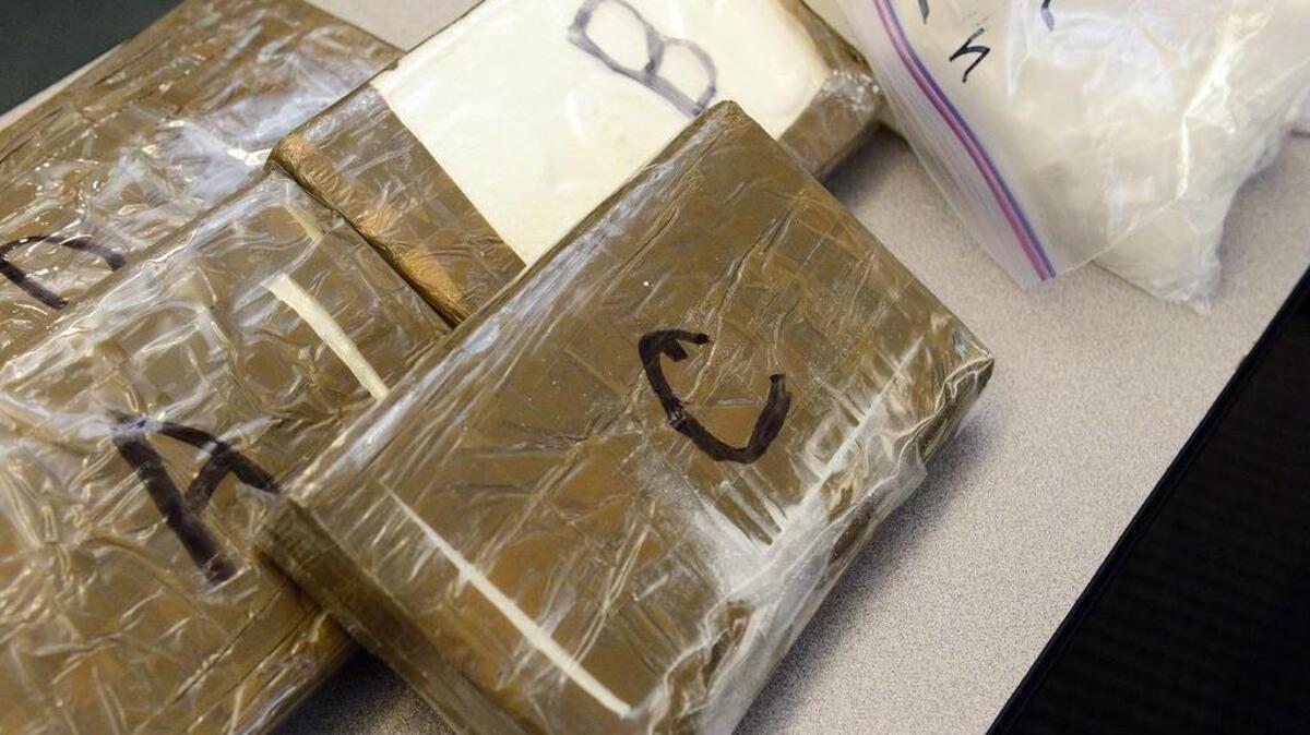 Drugs including methamphetamine and cocaine are displayed during a news conference to announce the results of an investigation to disrupt and dismantle a Central Valley drug trafficking organization in Fresno.