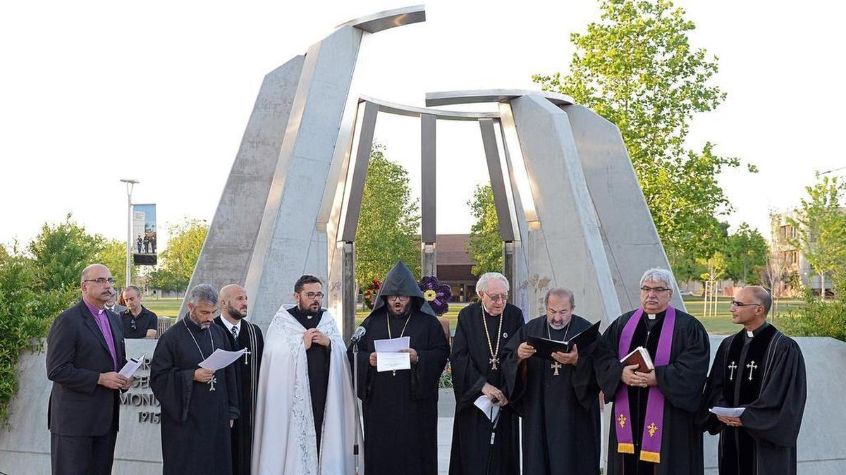 Local Armenian clergy members hold a prayer at the Armenian Genocide Memorial during a commemorative event to observe the 103rd anniversary of the Armenian Genocide at Fresno State on Tuesday, April 24, 2018.