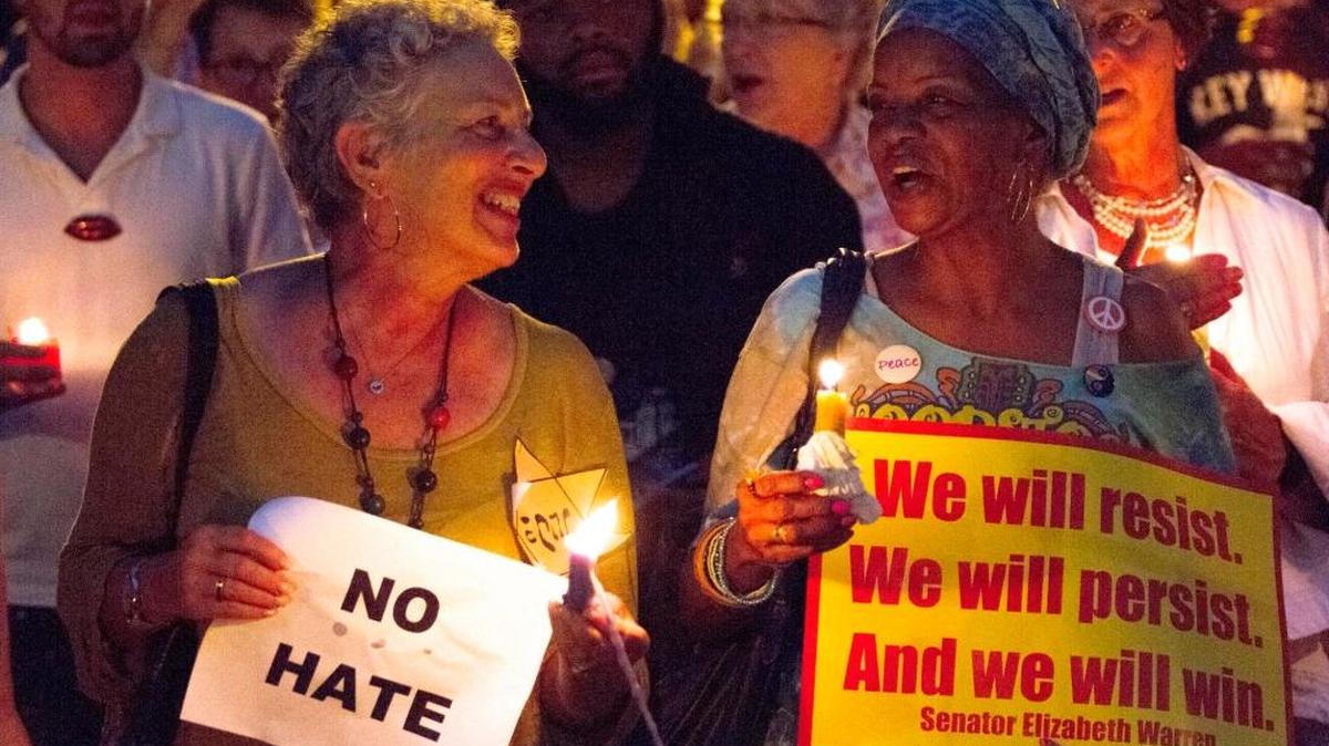 Kerry Rosen, left and Lala Archie sing "This Little Light of Mine" in Savannah, Ga., at Savannah Taking Action for Resistance's candlelight vigil for the victims of Charlottesville, Va. The vigil took place a day after a white supremacist rally spiraled into deadly violence in Charlottesville. Fresnans will gather for a discussion of white privilege on Wednesday nights, beginning in September.