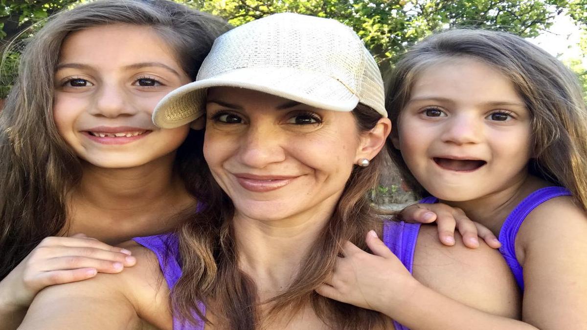 Jill Simonian and her daughters. She limits their screen time each day, preferring them to read or play outside.