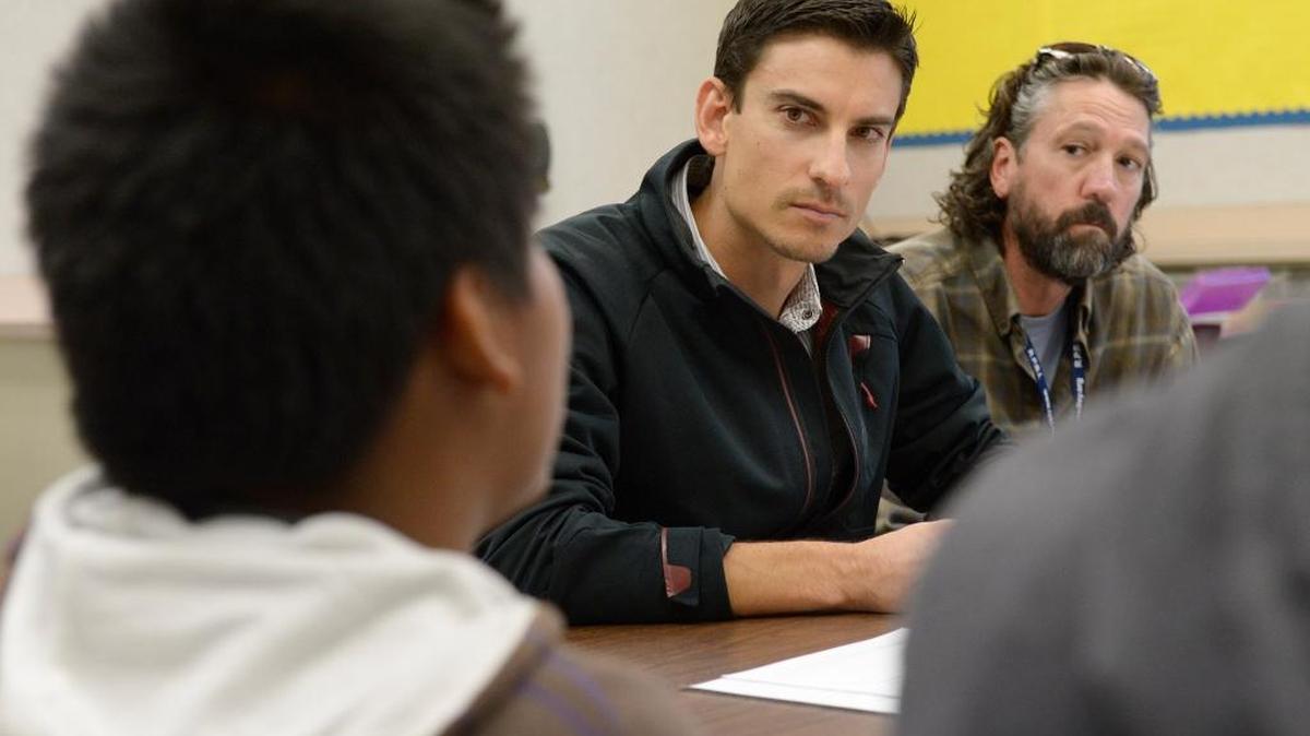 Jake Harder, center, of the Mennonite Central Committee, serves as a mediator and John Swenning of the Reedley Peace Building Initiative, the coordinator during a restorative justice "victim panel" for a student offender at General Grant Middle School in Reedley. The student panel members participated to show how the offender hurt his school community and peers with his actions.