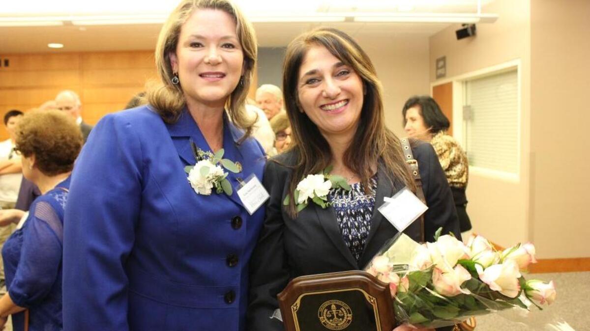 Fresno County District Attorney Lisa Smittcamp, left, congratulates Fresno County Superior Court Judge Houry Sanderson on her induction into the SJCL Alumni Hall of Fame.