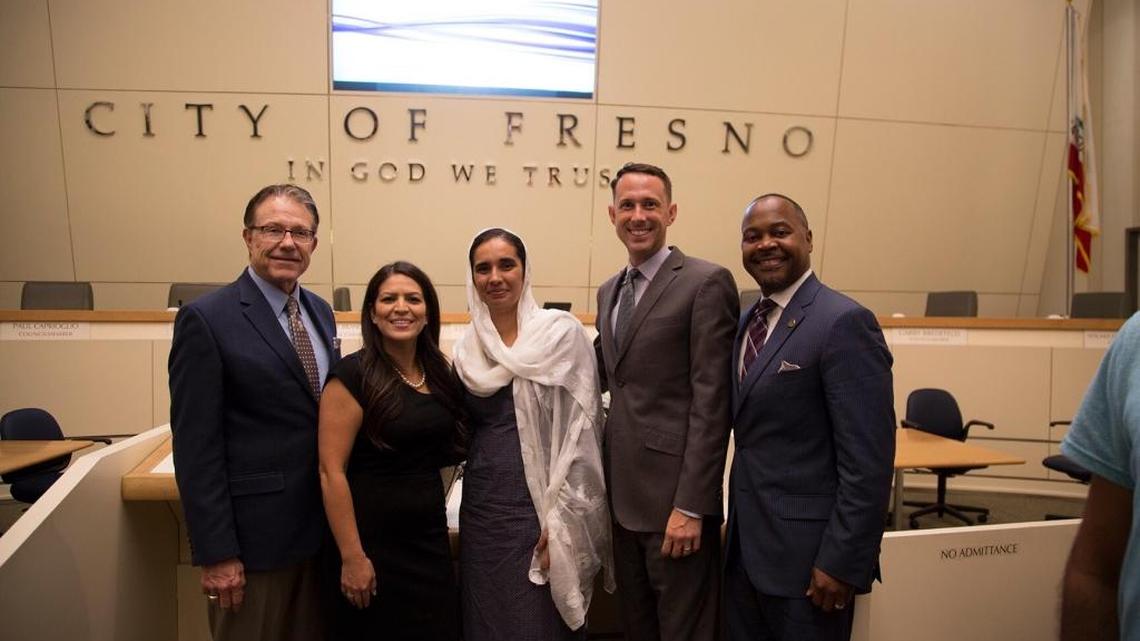 Navkiran Kaur Khalra, in white, is congratulated by Fresno City Councilmembers Paul Caprioglio, Esmeralda Soria, Clinton Olivier and Oliver Baines, who unanimously voted to name a Fresno park for Khara’s father, a Sikh human rights activist and hero.