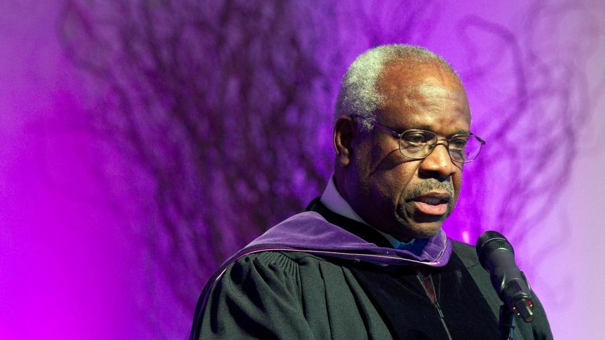 Supreme Court Justice Clarence Thomas speaks at College of the Holy Cross in Worcester, Mass. He has asked questions during Supreme Court arguments for the first time in 10 years. Thomas' question came Feb. 29 in a case in which the court is considering placing new limits on the reach of a federal law that bans people convicted of domestic violence from owning guns.