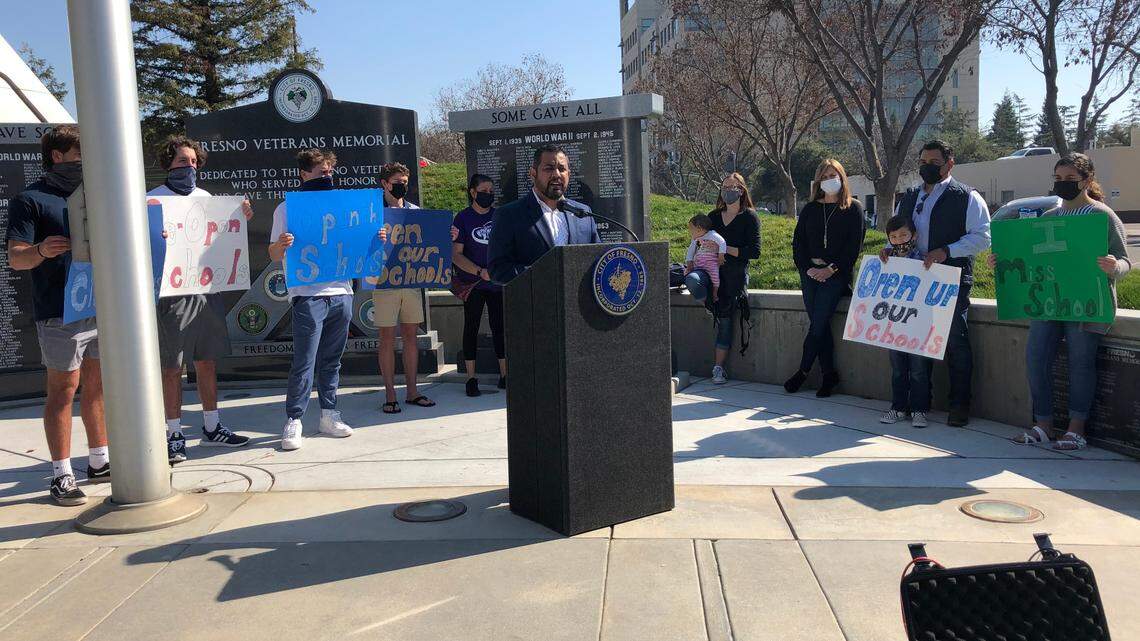 Fresno City Councilmember Miguel Arias and other Fresno Unified parents call out the school district on its reopening plan during a news conference Friday, Feb. 26 in front of City Hall.