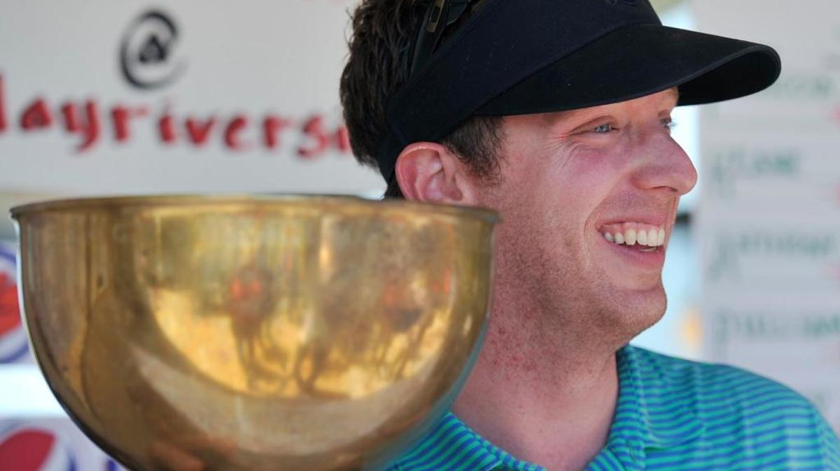 Jonathan Keane enjoys the spoils after winning the 88th Fresno City Amateur Championship a year ago. Keane is back for the annual Memorial Day weekend tournament this year, one of eight former champions in the field.