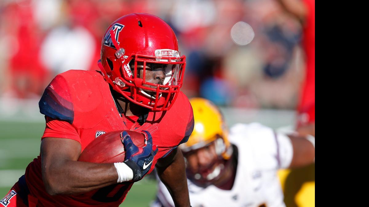 
Arizona running back Nick Wilson scores a touchdown during the first half against Arizona State last November. The ex-Central High star was named to the Maxwell Award watch list this week.
