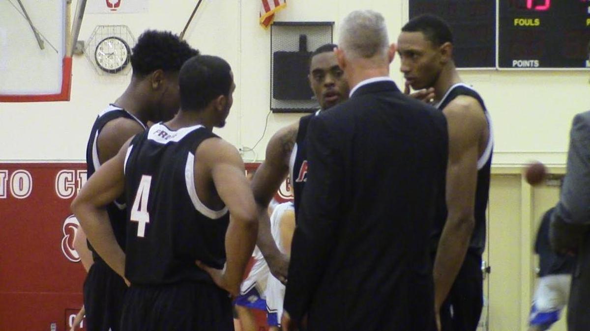 Fresno City College men’s basketball coach Ed Madec gives his players instructions in a 111-71 victory over San Jose City in a NorCal Regional game on Saturday.