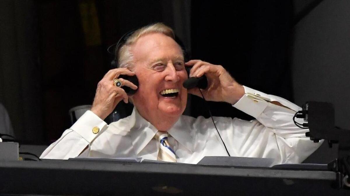 Los Angeles Dodgers’ Hall of Fame announcer Vin Scully puts his headset on before a baseball game between the Los Angeles Dodgers and the San Francisco Giants, Monday, Sept. 19, 2016, in Los Angeles. Scully begins broadcasting his final homestand this week. He will retire at the end of the season, his 67th as the team’s play-by-play announcer.