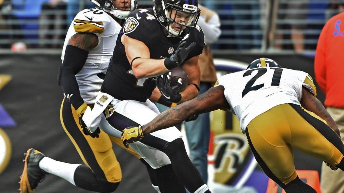 Pittsburgh’s Robert Golden, right, and Ryan Shazier work to take down Baltimore fullback Kyle Juszczyk during the fourth quarter Sunday at M&T Bank Stadium in Baltimore. Golden had seven tackles, but the Steelers fell to Baltimore 20-17