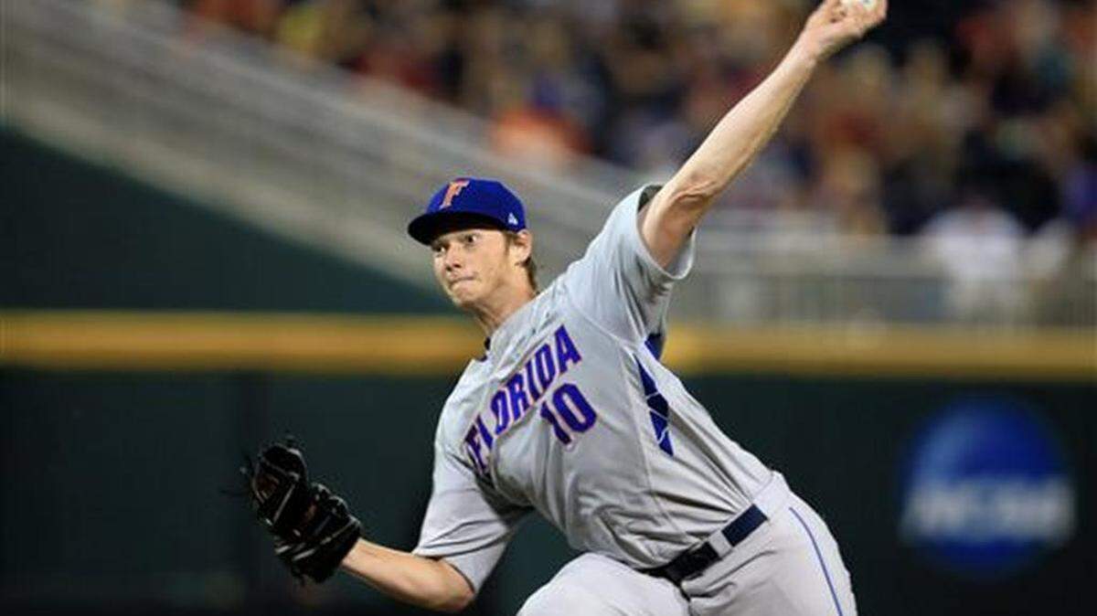 FILE - In this June 15, 2015, file photo, Florida pitcher A.J. Puk (10) delivers against Virginia in the fifth inning of an NCAA College World Series baseball game at TD Ameritrade Park in Omaha, Neb. Puk is a top prospect in the Major League Baseball draft.