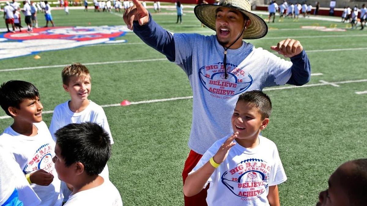 Derron Smith, top, works with kids during Big B.A.N.G. Weekend, a youth clinic featuring former Fresno State stars now with the NFL on July 16. Smith is entering his second season with the Cincinnati Bengals.