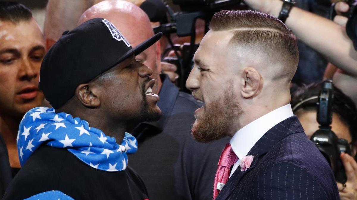 Floyd Mayweather Jr., left, and Conor McGregor will fight in a boxing match Aug. 26 from Las Vegas. Those in Fresno can watch the bout on the big screen, with Edwards Fresno Stadium 22 in River Park scheduled to broadcast the fights. Admission is expected to be about $40.