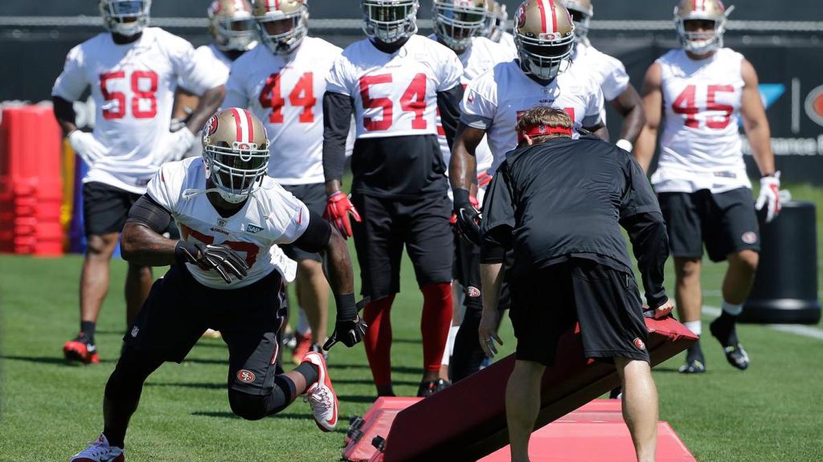 Linebacker NaVorro Bowman participates in a drill Tuesday at the 49ers’ training facility. The defensive leader is setting the tone for the rest of the team.