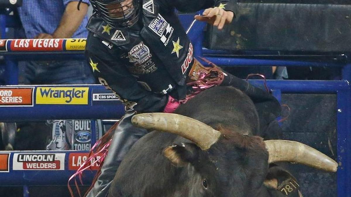 Shane Proctor rides “Asteroid” during the PBR Iron Cowboy competition Feb. 27, 2016, at AT&T Stadium in Arlington, Texas. Proctor, who won the event and is No. 5 in the world rankings, headlines the early lineup for the opening night PBR event at the 2016 Clovis Rodeo.