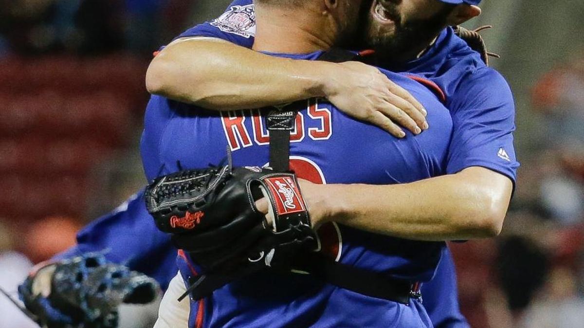 Chicago Cubs starting pitcher Jake Arrieta, right, celebrates with catcher David Ross after the final out of his no-hitter against the Cincinnati Reds, Thursday, April 21, 2016, in Cincinnati. The Cubs won 16-0.