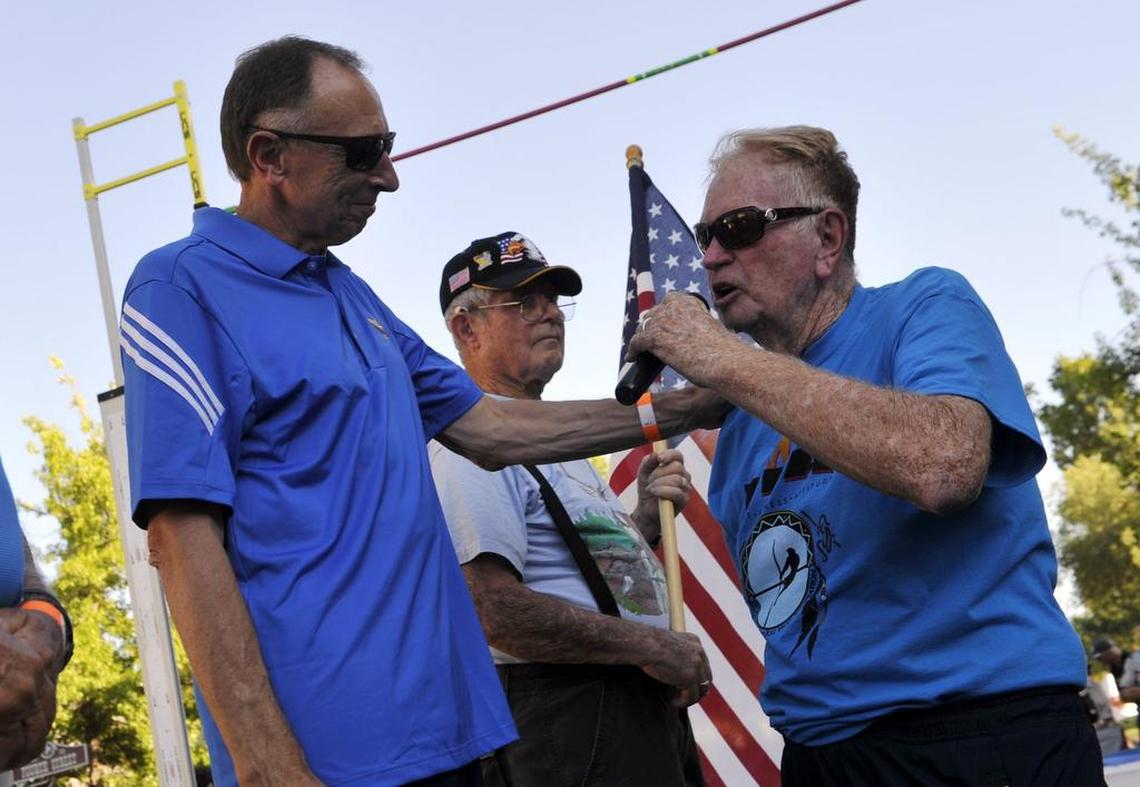 Bob Fraley shares the mic with then-Golden State Warriors assistant coach (and former Fresno State basketball coach) Ron Adams, left, at the North American Pole Vaulting Association Championships in Old Town Clovis in July 2015. Fraley coached Adams in basketball at Laton High School.