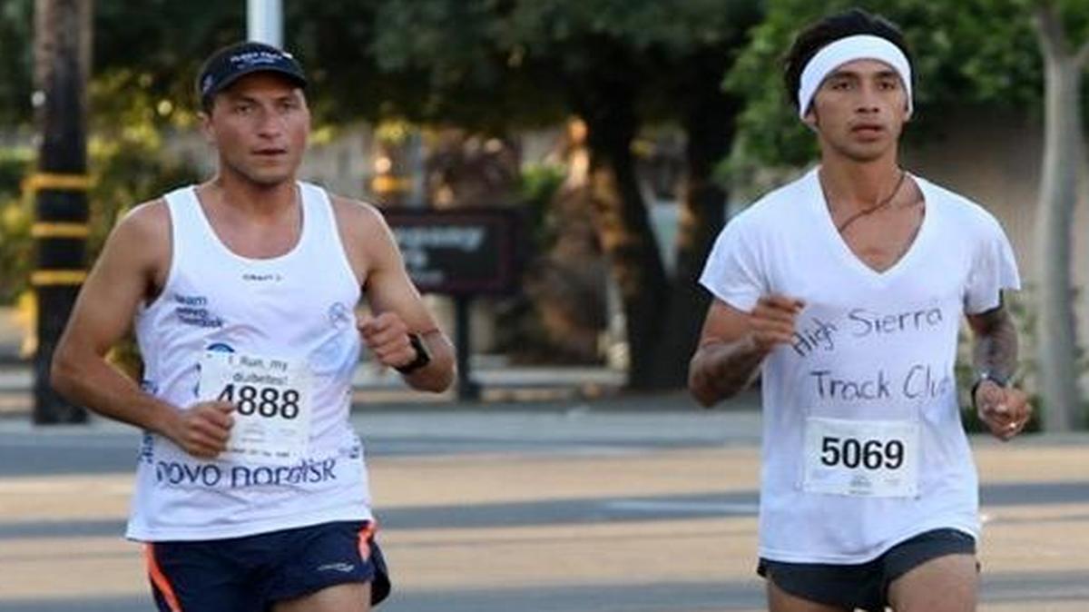 Benjamín Madrigal of Madera and Matthew Morales of Visalia run side by side as they approach the Tower Theatre during the seventh annual California Classic Half Marathon on April 2, 2017. Madrigal finished third, behind Morales. On Monday, April 17, Madrigal was the leading central San Joaquin Valley finisher in the Boston Marathon and Morales was No. 5.