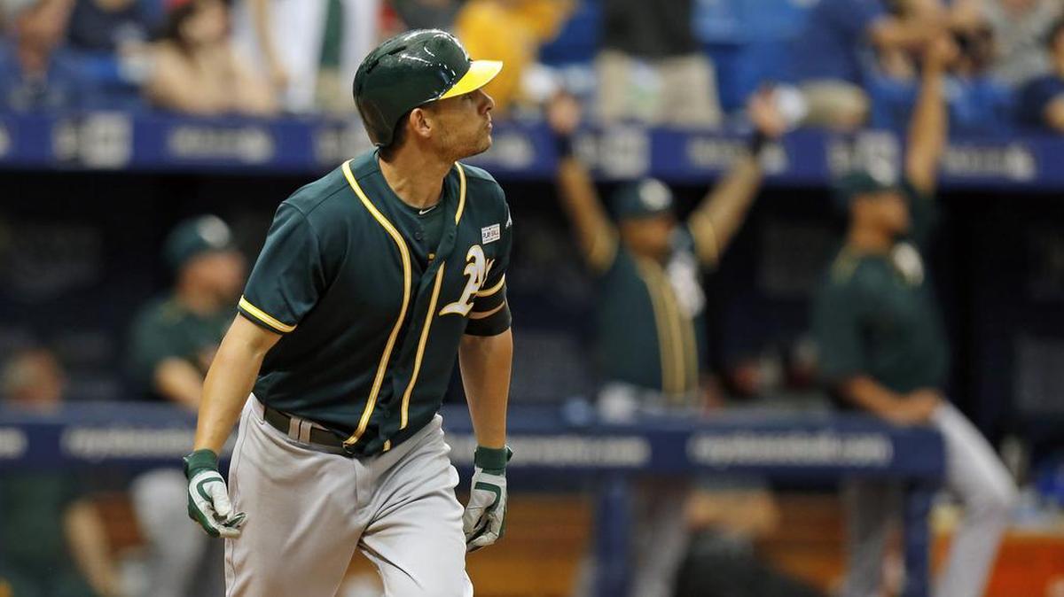 Oakland’s Danny Valencia watches his two-run homer in the ninth inning – his third home run of the day – leave the ballpark as the A’s beat the Rays 7-6 in St. Petersburg, Fla., on Sunday, May 15, 2016.