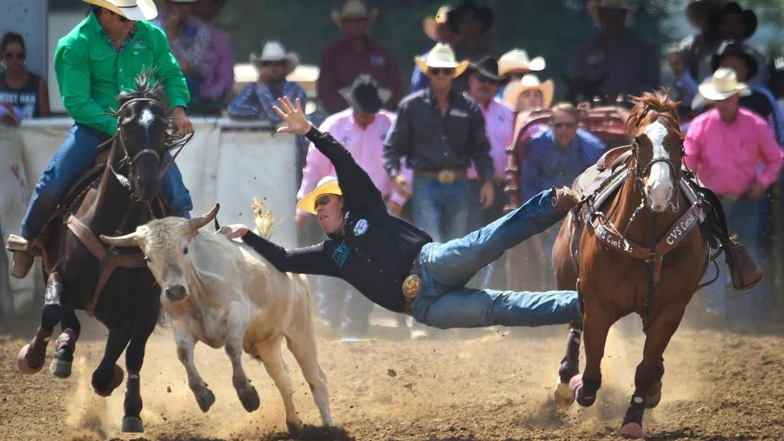 Jacob Talley of Keatchie, La., has to make quite the stretch to grab hold of the steer while competing in the event finals of the 102nd Clovis Rodeo on Sunday afternoon, April 24, 2016.