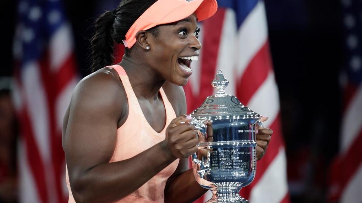 Sloane Stephens holds up the championship trophy Saturday after winning the U.S. Open.