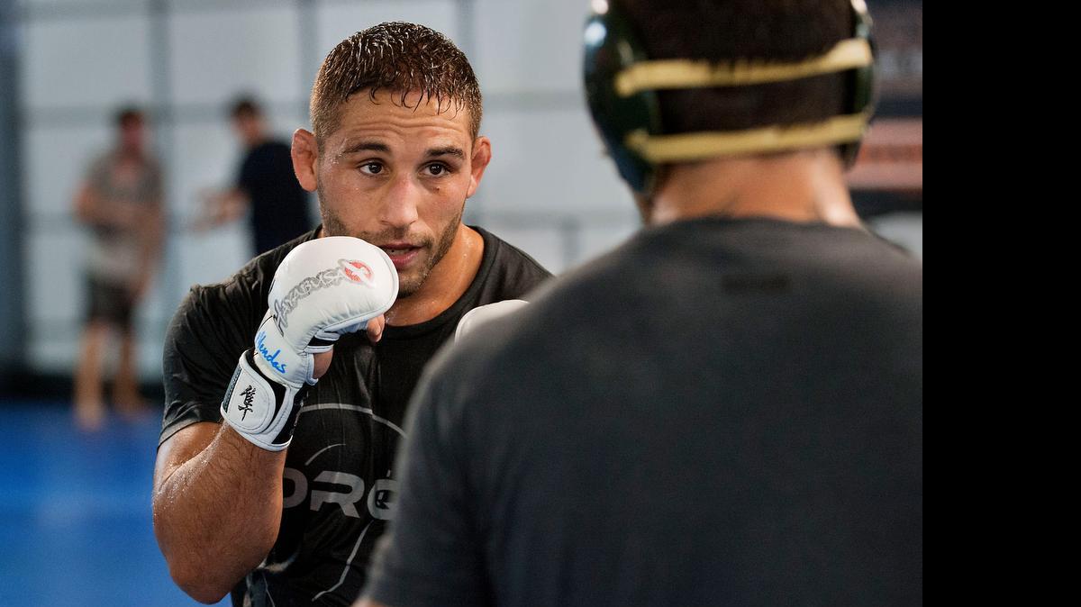
UFC fighter Chad Mendes, left, spars with Vince Murdock during a 2014 workout at Ultimate Fitness gym in Sacramento.
