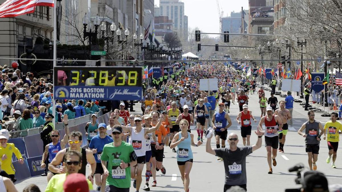 Runners approach the finish line of the 120th Boston Marathon on Monday, April 18, 2016, in Boston.