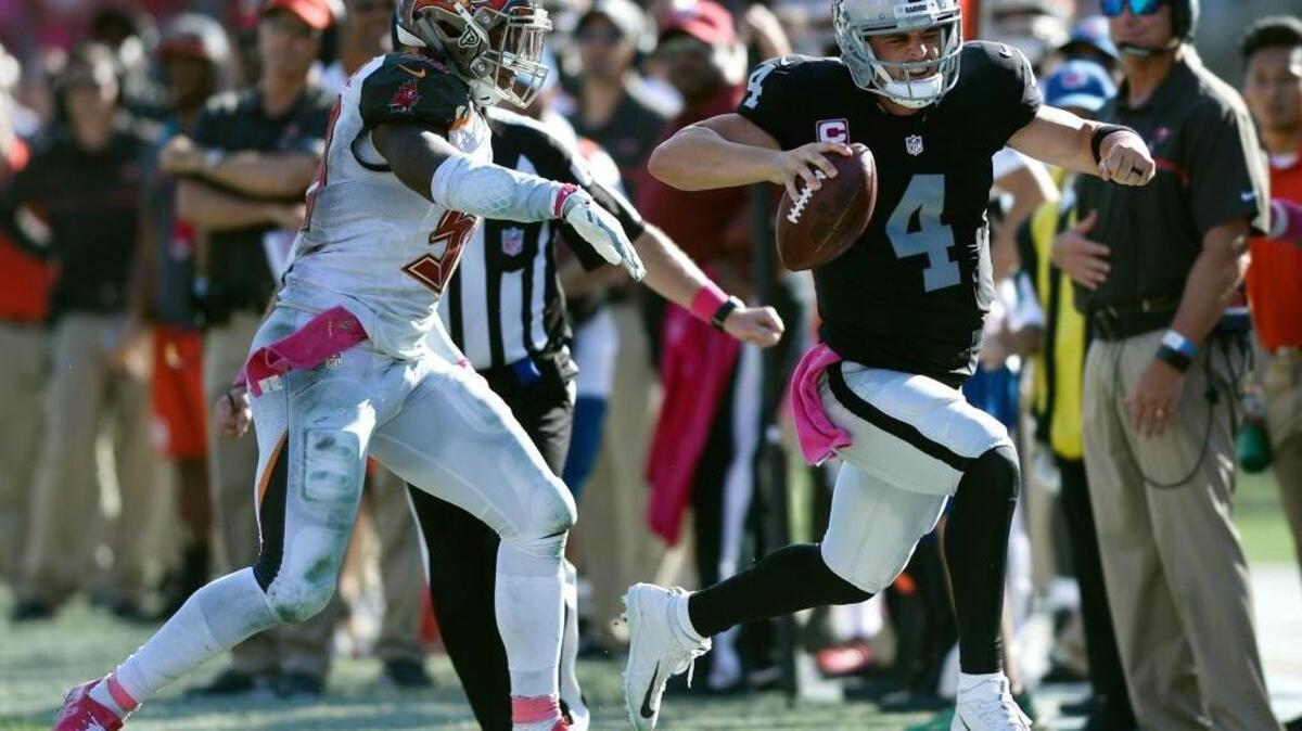 Oakland Raiders quarterback Derek Carr (4) was named the AFC offensive player of the week Wednesday after passing for a franchise-record 513 yards and four touchdowns, including a 41-yard game-winning touchdown to Seth Roberts in a 30-24 overtime victory over the Tampa Bay Buccaneers.