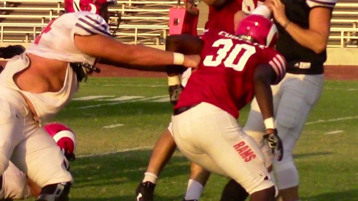 Fresno City College offensive lineman Kyle Horton, left, was picked on in elementary school but became a different person while playing football at the middle-school level and Hoover High.