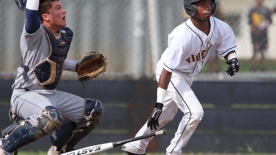 
Edison’s Deondre Howard gets out of the box after connecting for a hit in a 2013 prep baseball game against Bullard. Howard was shot and killed Saturday in Fresno. He was 21.

