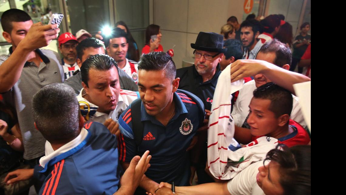 
Chivas de Guadalajara midfielder Marco Fabián greets fans as the team arrives last week at Sacramento International Airport. Chivas will face off against fellow Mexican league team Club Atlas on Friday night at Chukchansi Park.

