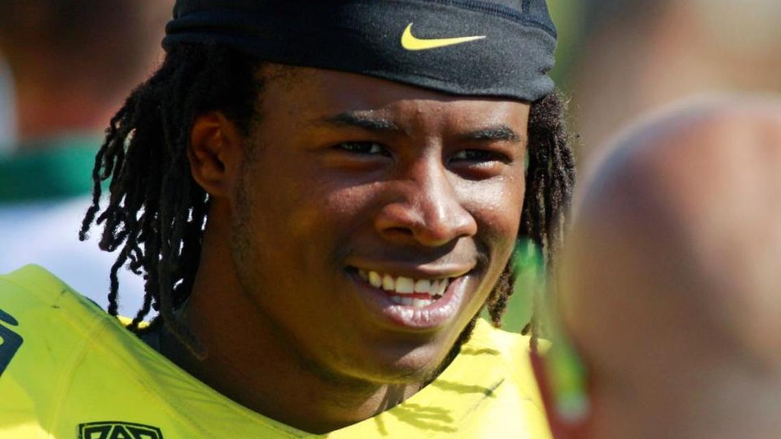 In this Sept. 10, 2011, photo, Cliff Harris stands on the sideline during an Oregon football game.