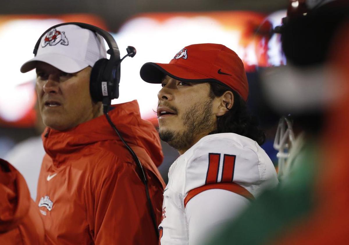 Fresno State quarterback Jorge Reyna, right, checks the scoreboard as time winds down in the Bulldogs’ 43-24 loss at Air Force on Saturday, Oct. 12, 2019, at Air Force Academy, Colo.
