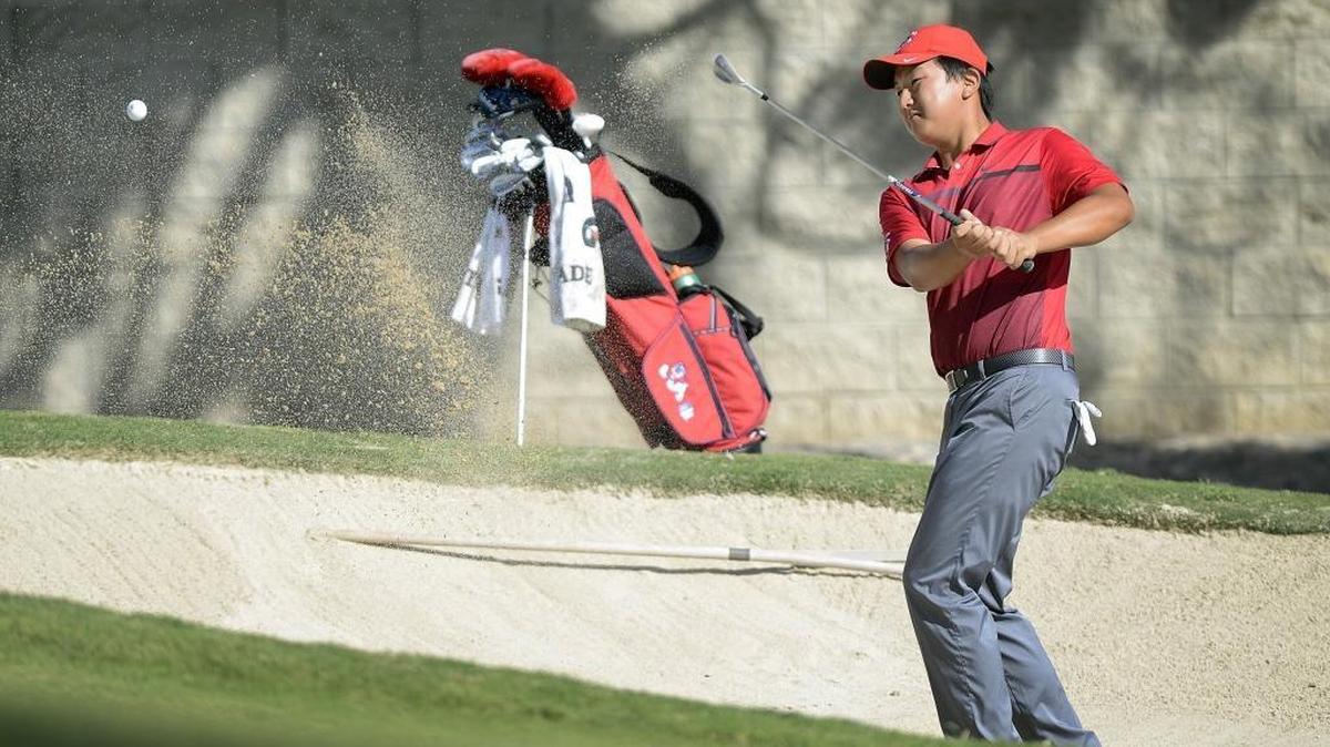 
Fresno State golfer Alex Lee hits out of the bunker on the seventh hole during the second annual Nick Watney Invitational golf tournament at Fort Washington Country Club on Monday, Oct. 5, 2015.
