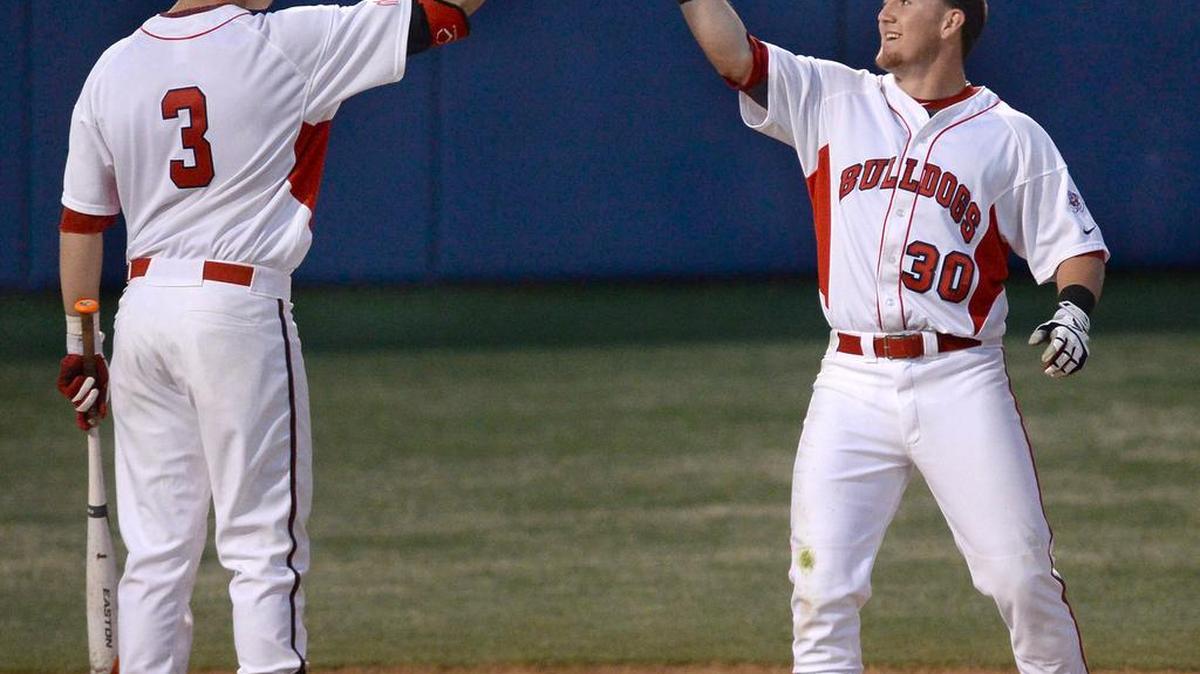 Fresno State Austin Guibor, at right being congratulated after hitting a home run by former teammate Trent Woodward, leads the Bulldogs into their season-opening series against Creighton this weekend at Beiden Field.