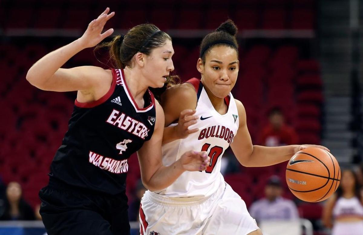 Fresno State guard Candice White, right, drives by Eastern Washington's Delaney Hodgins, left, in the Bulldogs 81-56 victory on Friday, Nov. 10, 2017 in Fresno. White scored 15 points in the victory and also had seven rebounds and two assists.
