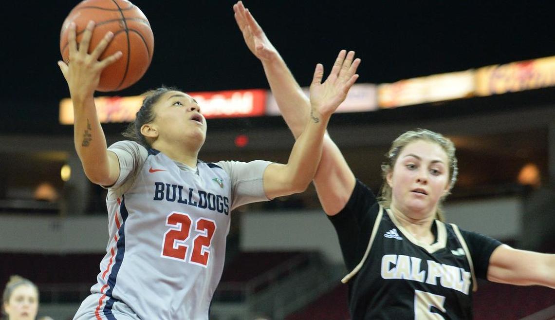 Fresno State’s Aly Gamez, left, drives to the hoop against Cal Poly’s Malia Holt in their game at the Save Mart Center on Wednesday, Nov. 14, 2018.