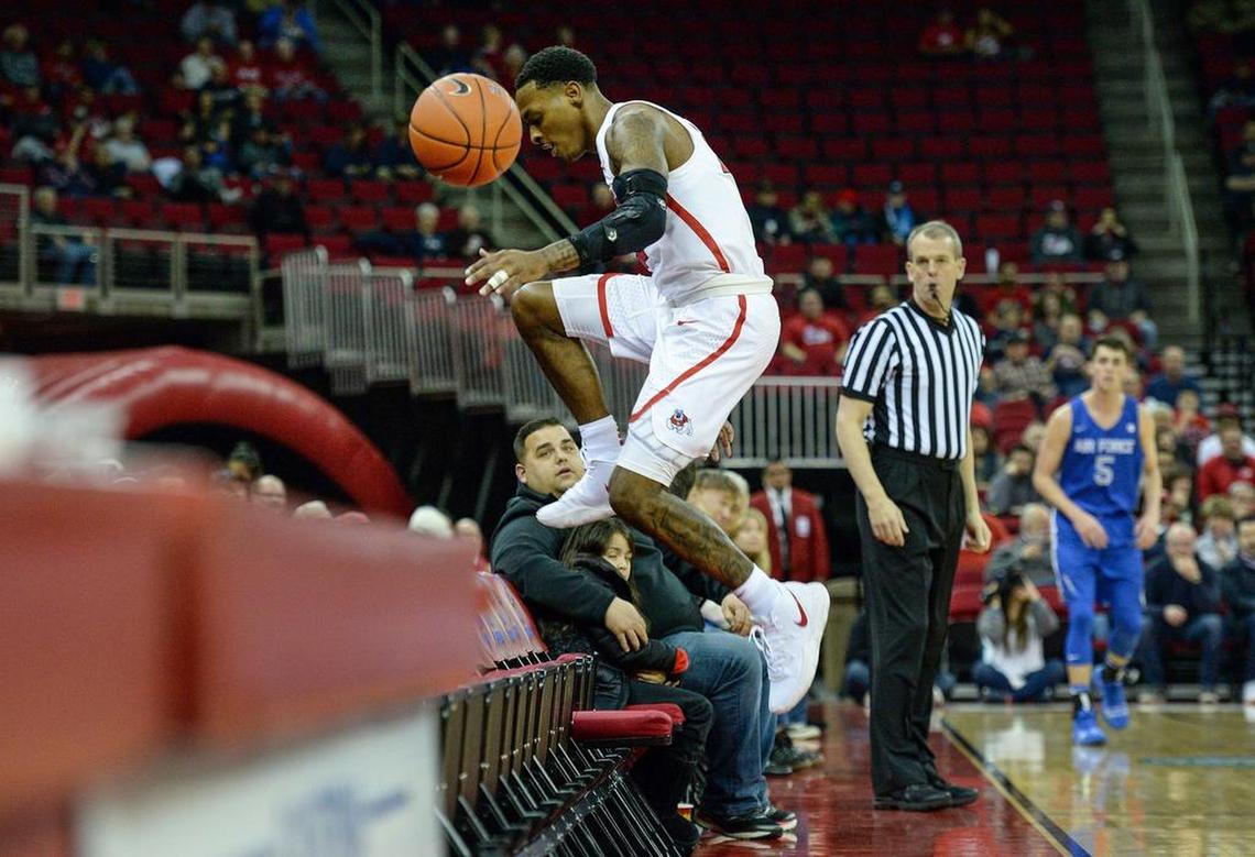 Fresno State guard Deshon Taylor hops over the front row seats while chasing the ball out of bounds during their 64-61 loss to Air Force on Wednesday, Feb. 20, 2019, at the Save Mart Center. Taylor scored a game-hgih 23 points, but the Bulldogs struggled at the offensive end, hitting only 35.1 percent of their shots..